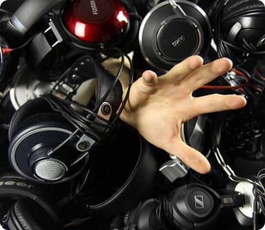 Hands coming from headphones